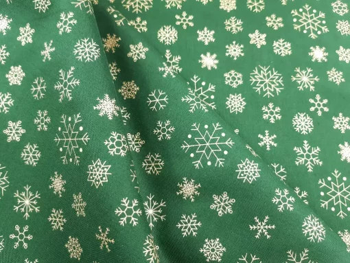 Weihnachten Baumwollstoff Schneeflocken grün gold Falten
