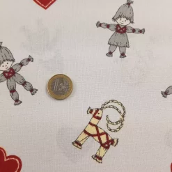 Weihnachtsstoff Baumwolle natur Strohmann und Strohziege Euro als Größenvergleich